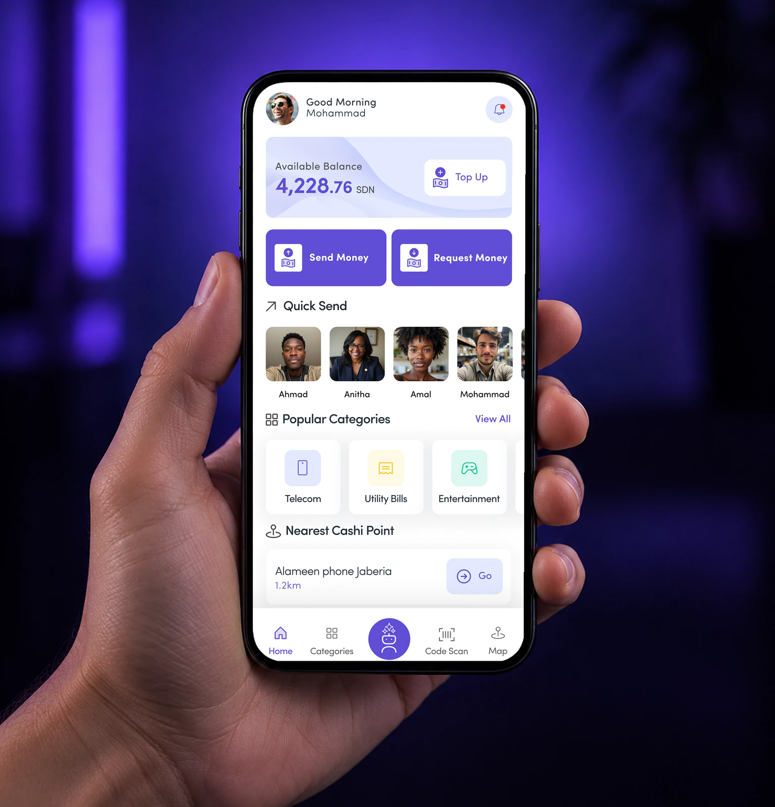 The Cashi wallet home screen on a phone held in violet light